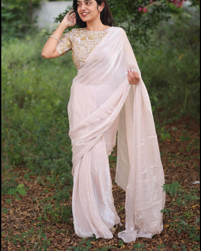Shiny white party wear with heavy work blouse saree