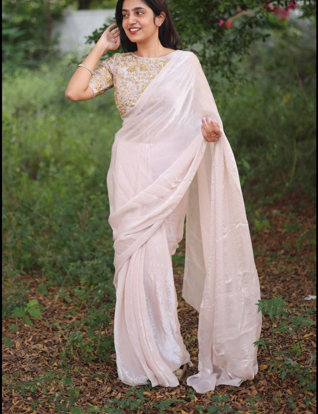 Shiny white party wear with heavy work blouse saree