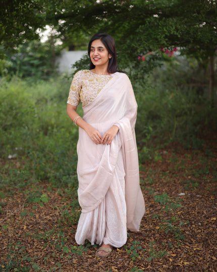 Shiny white party wear with heavy work blouse saree