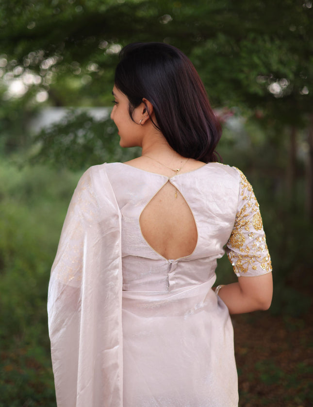 Shiny white party wear with heavy work blouse saree