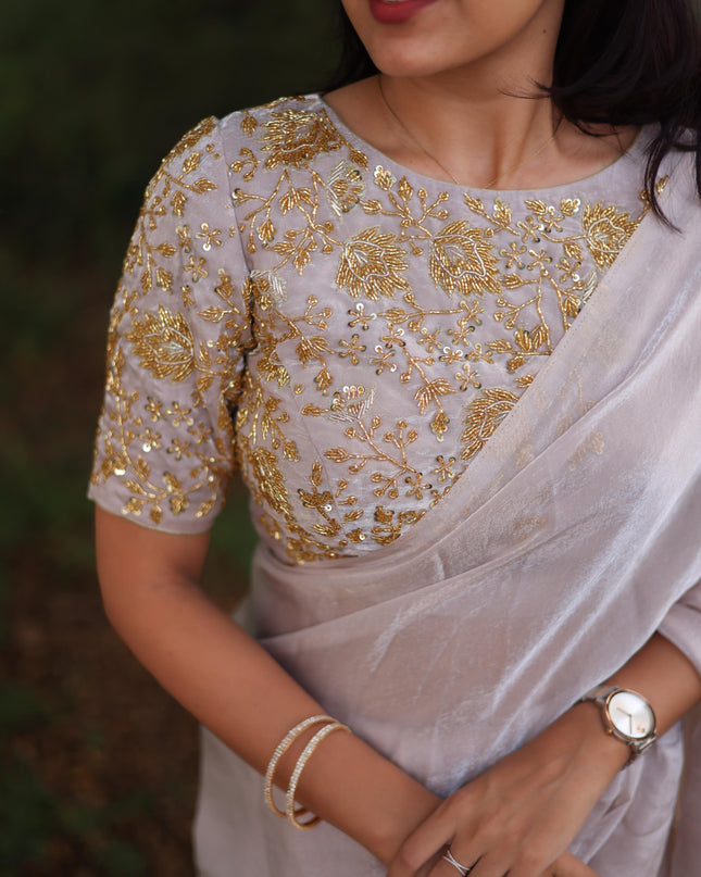 Shiny white party wear with heavy work blouse saree