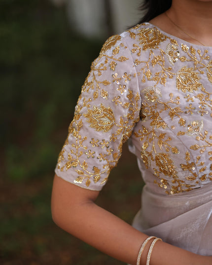 Shiny white party wear with heavy work blouse saree