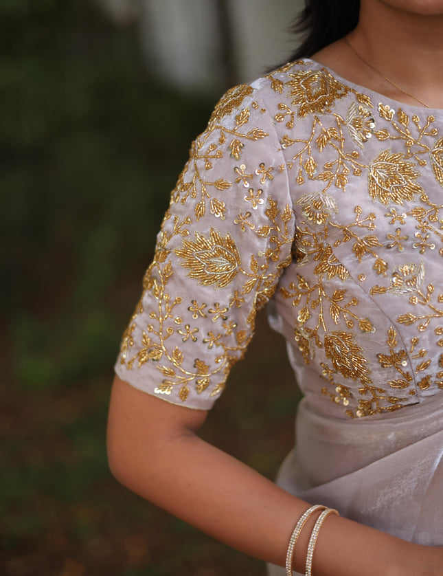 Shiny white party wear with heavy work blouse saree