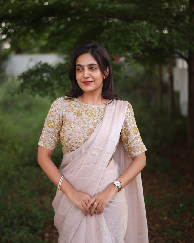 Shiny white party wear with heavy work blouse saree