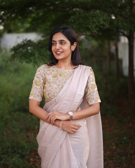 Shiny white party wear with heavy work blouse saree