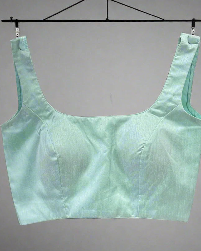 Sea green semi raw silk sleeveless blouse