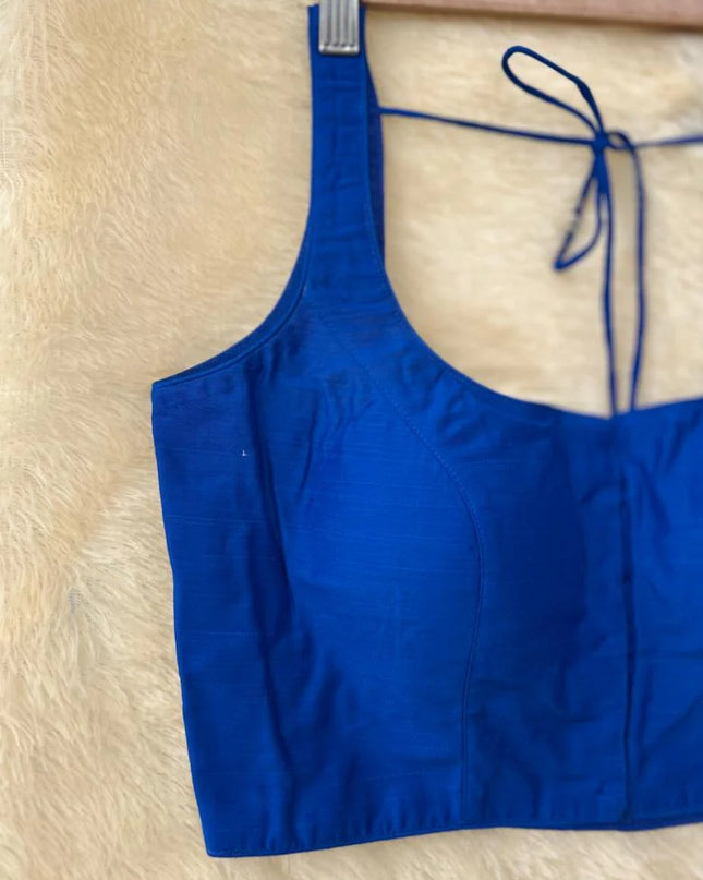 Blue raw silk sleeveless blouse