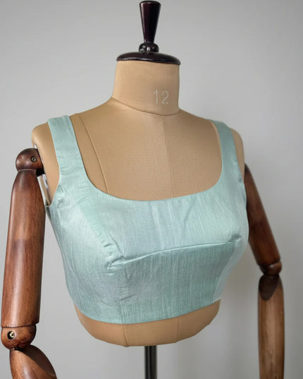 Sea green semi raw silk sleeveless blouse