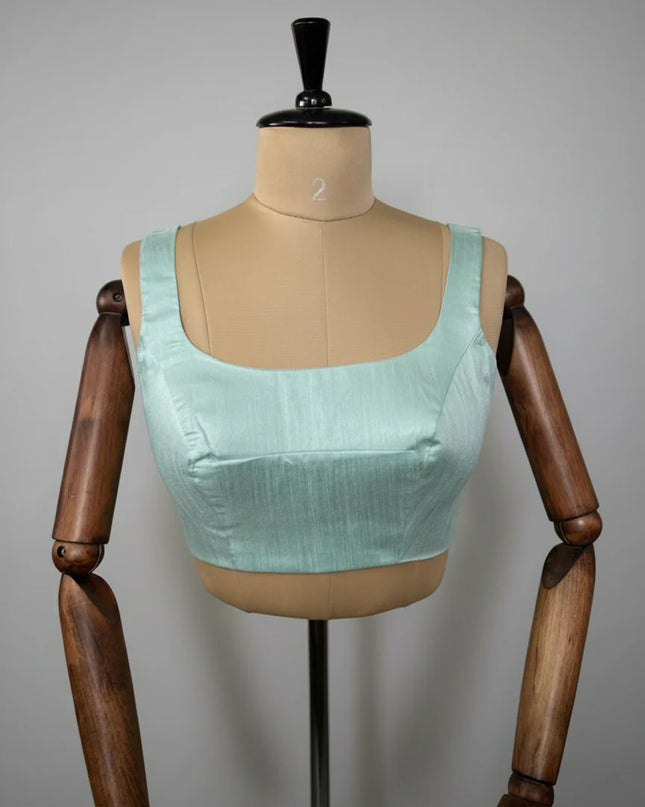 Sea green semi raw silk sleeveless blouse