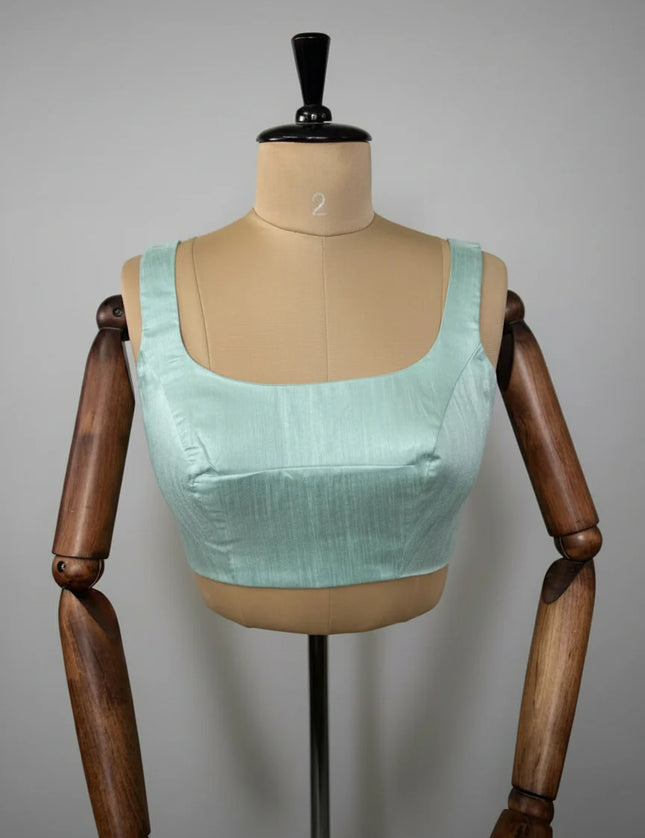 Sea green semi raw silk sleeveless blouse